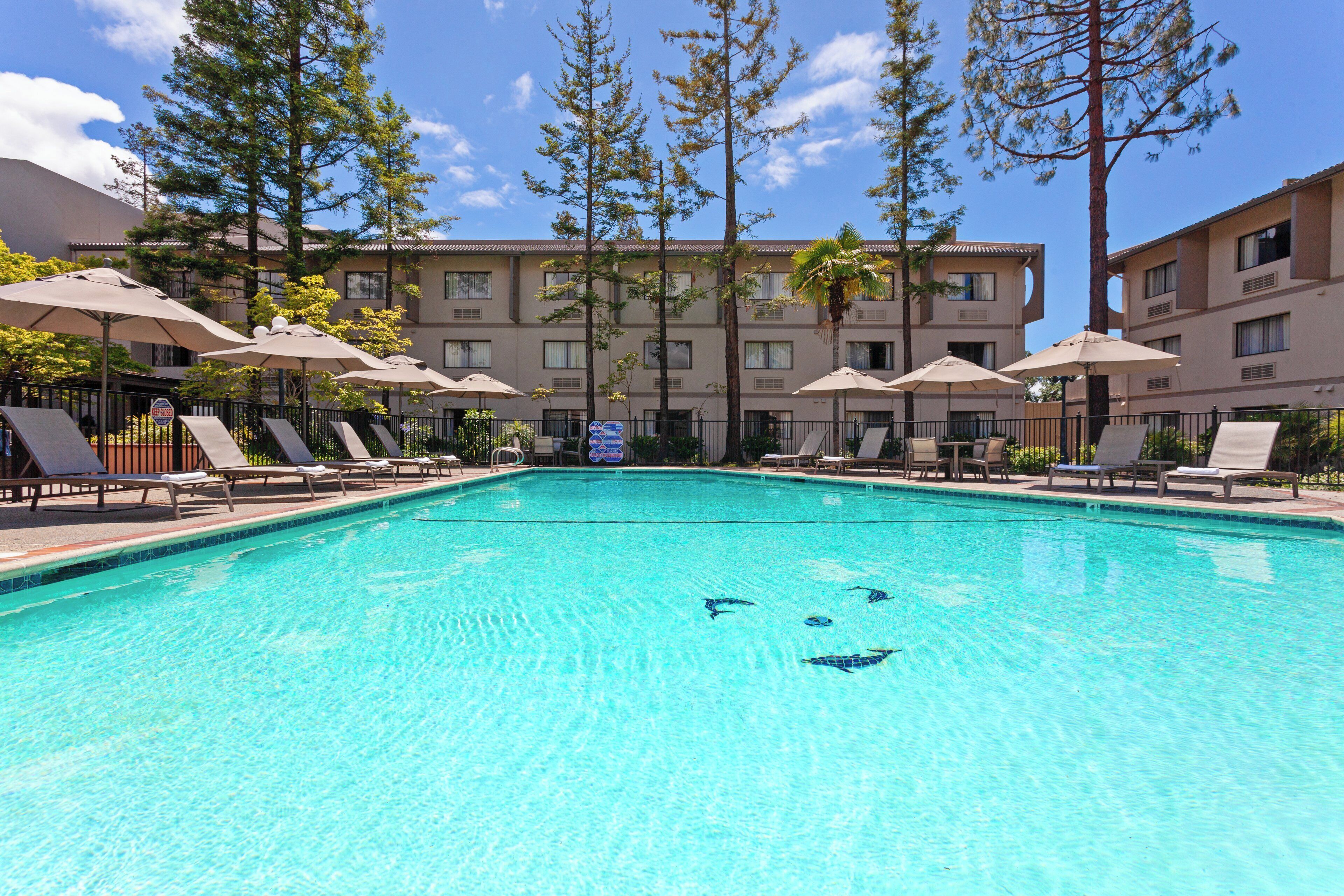 Outdoor pool, open 6:00 AM to 10:00 PM, sun loungers