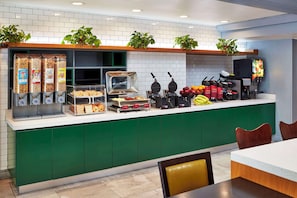 A breakfast bar with various food items and a waffle maker. - Best Western Plus Meridian Inn & Suites, Anaheim-Orange (Orange)