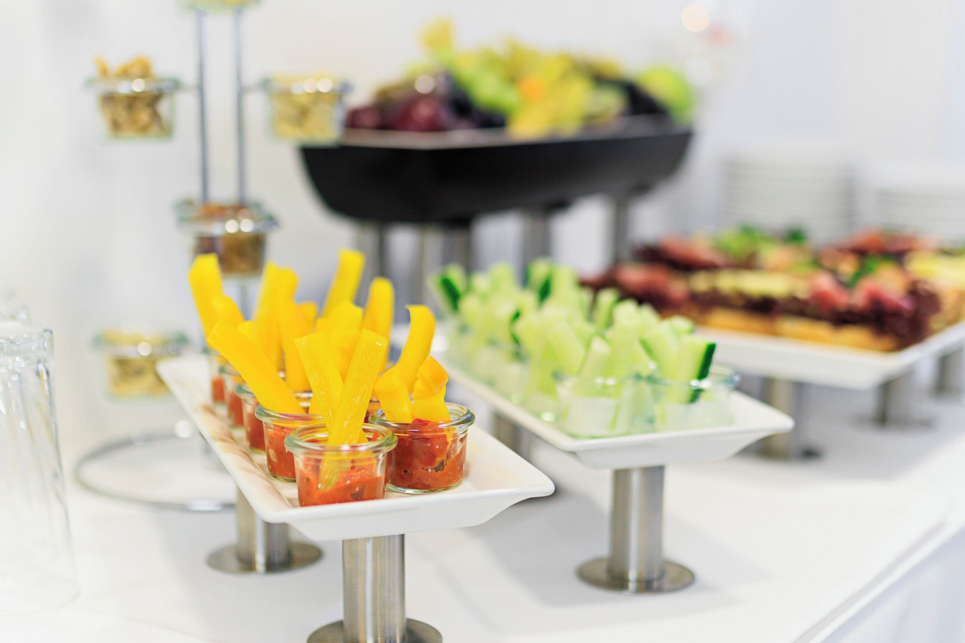 A buffet with various food items and beverages.