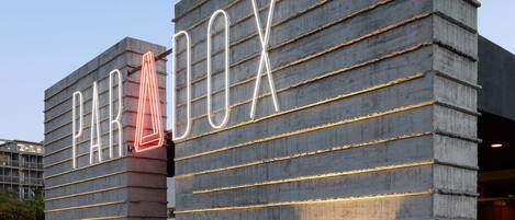 A building with a modern design, featuring the name 'PARADOX' prominently displayed on its facade.