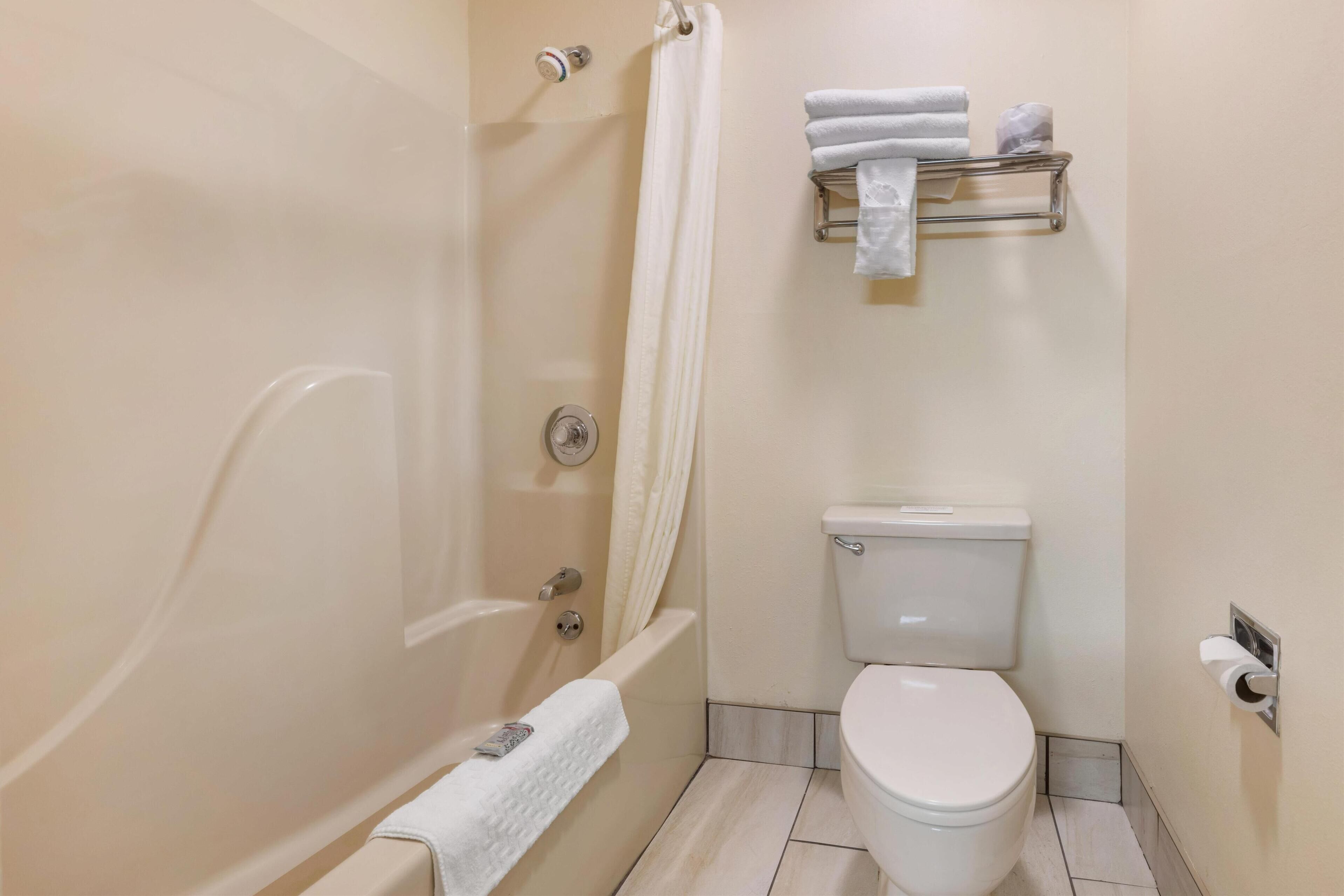 standard room, 2 double beds, non smoking, refrigerator & microwave | bathroom | combined shower/bathtub, free toiletries, hair dryer, towels