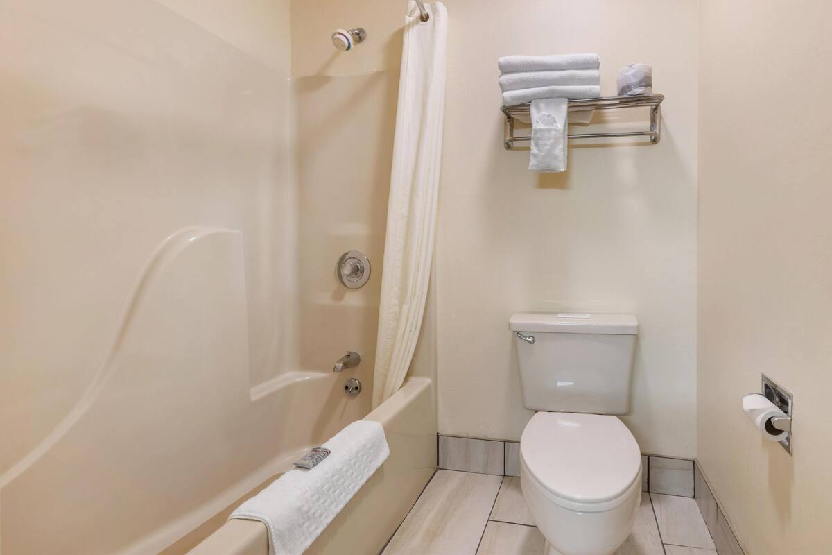 standard room, 2 double beds, non smoking, refrigerator & microwave | bathroom | combined shower/bathtub, free toiletries, hair dryer, towels