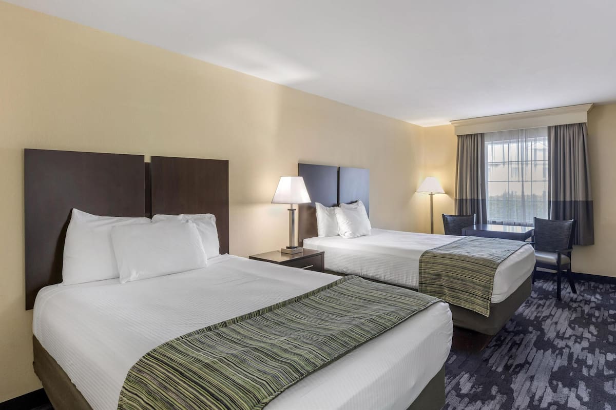 standard room, 2 double beds, non smoking, refrigerator & microwave | in-room safe, desk, iron/ironing board, free cots/infant beds