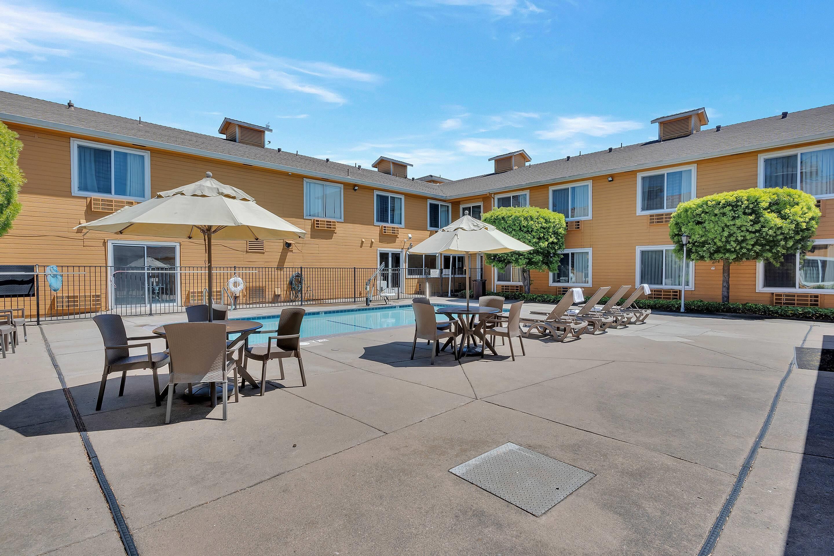 Outdoor pool, open 8 AM to 9 PM, pool umbrellas, sun loungers