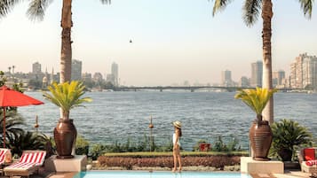 Outdoor pool, open 8:00 AM to 7:00 PM, pool umbrellas, sun loungers