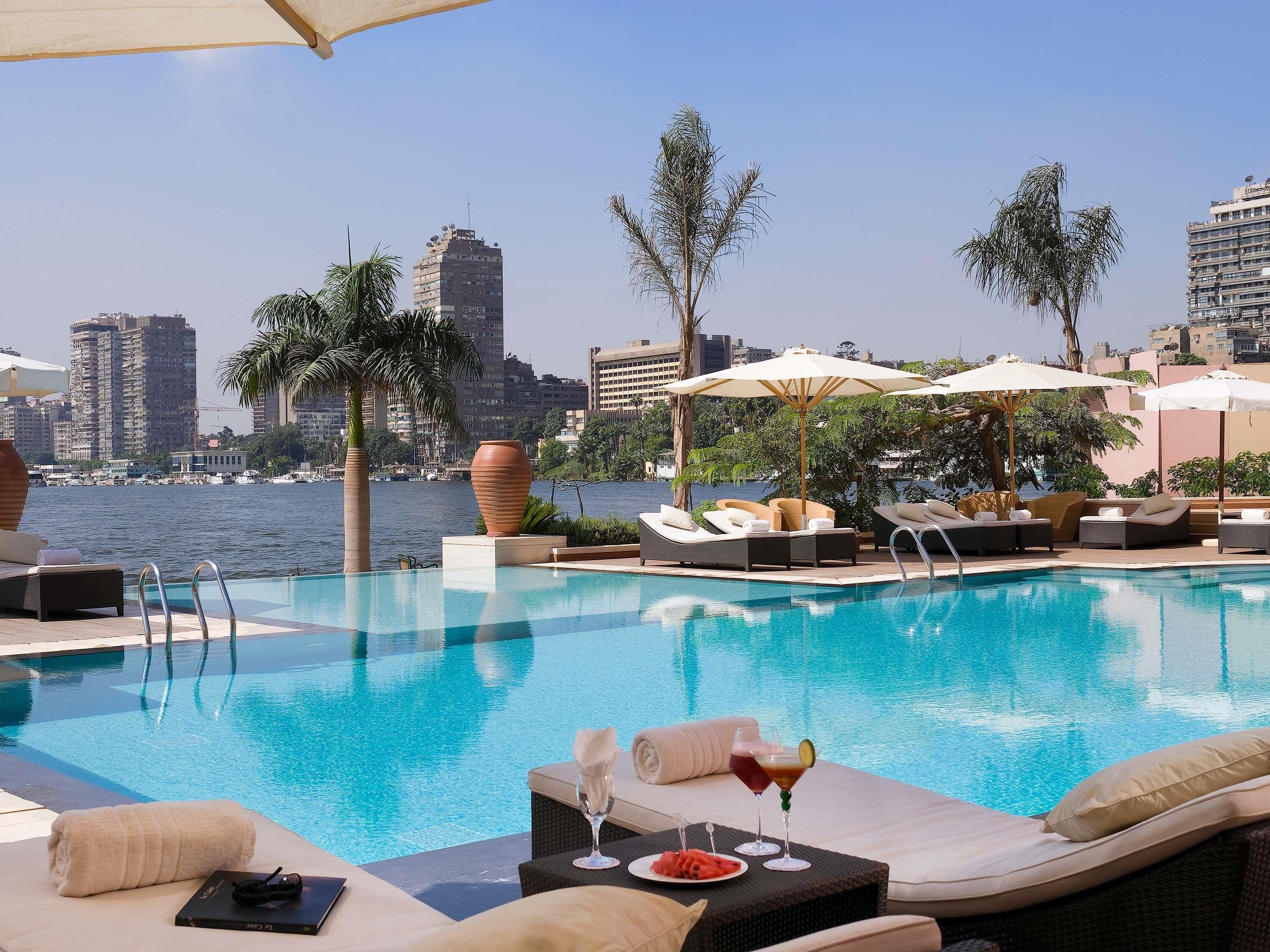 Outdoor pool, open 8:00 AM to 7:00 PM, pool umbrellas, sun loungers