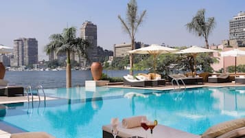 Outdoor pool, open 8:00 AM to 7:00 PM, pool umbrellas, sun loungers