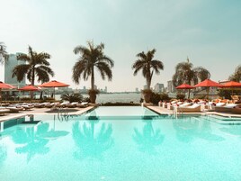 Outdoor pool, open 8:00 AM to 7:00 PM, pool umbrellas, pool loungers