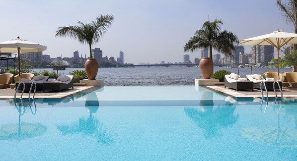 Outdoor pool, open 8:00 AM to 7:00 PM, pool umbrellas, sun loungers