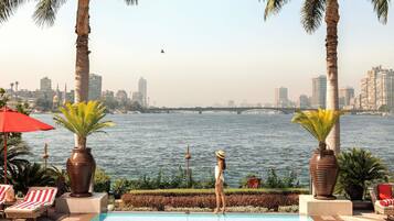 Outdoor pool, open 8:00 AM to 7:00 PM, pool umbrellas, pool loungers