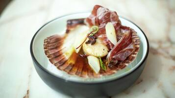 A bowl of food with various ingredients.