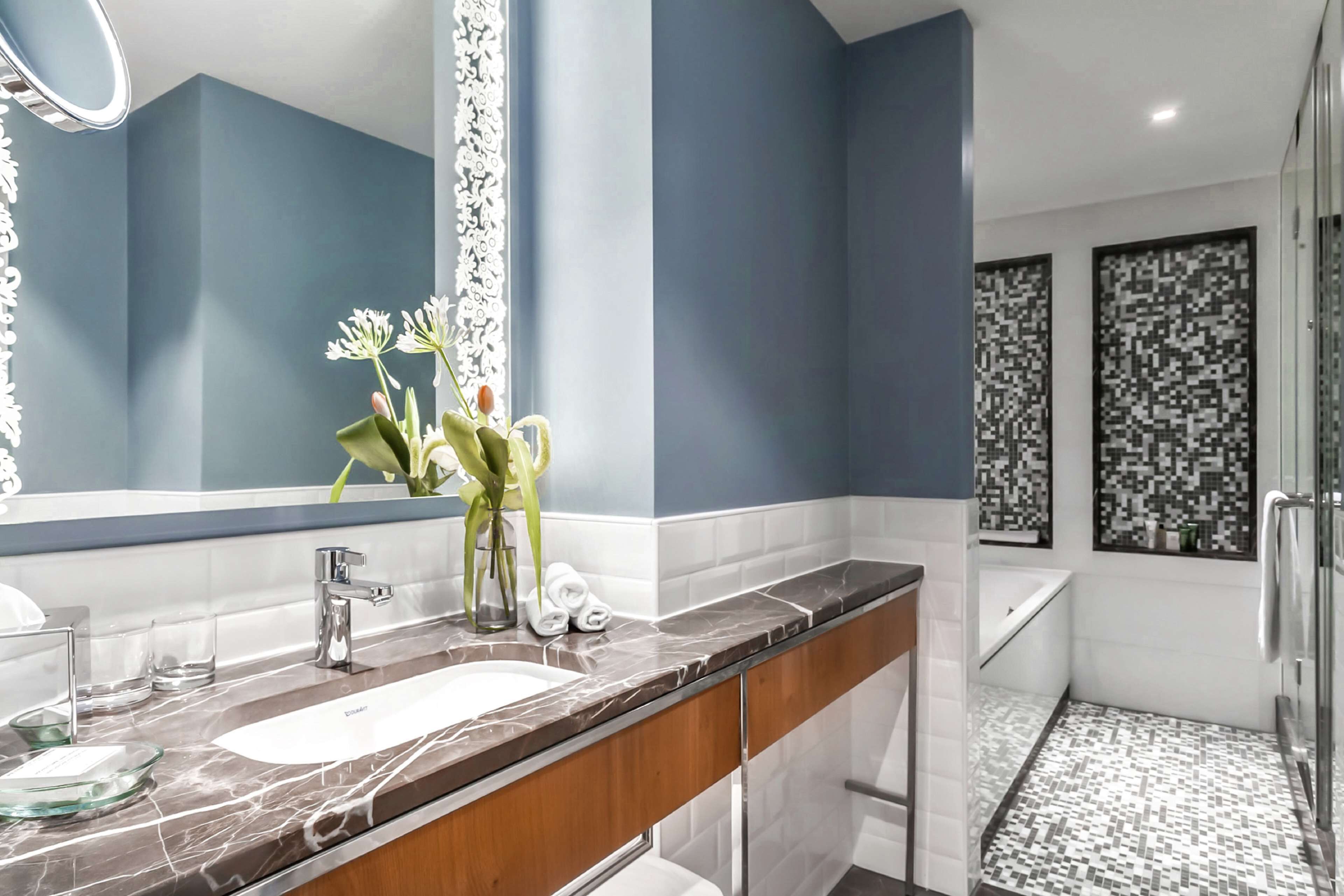 hydromassage showerhead, designer toiletries, hair dryer, towels