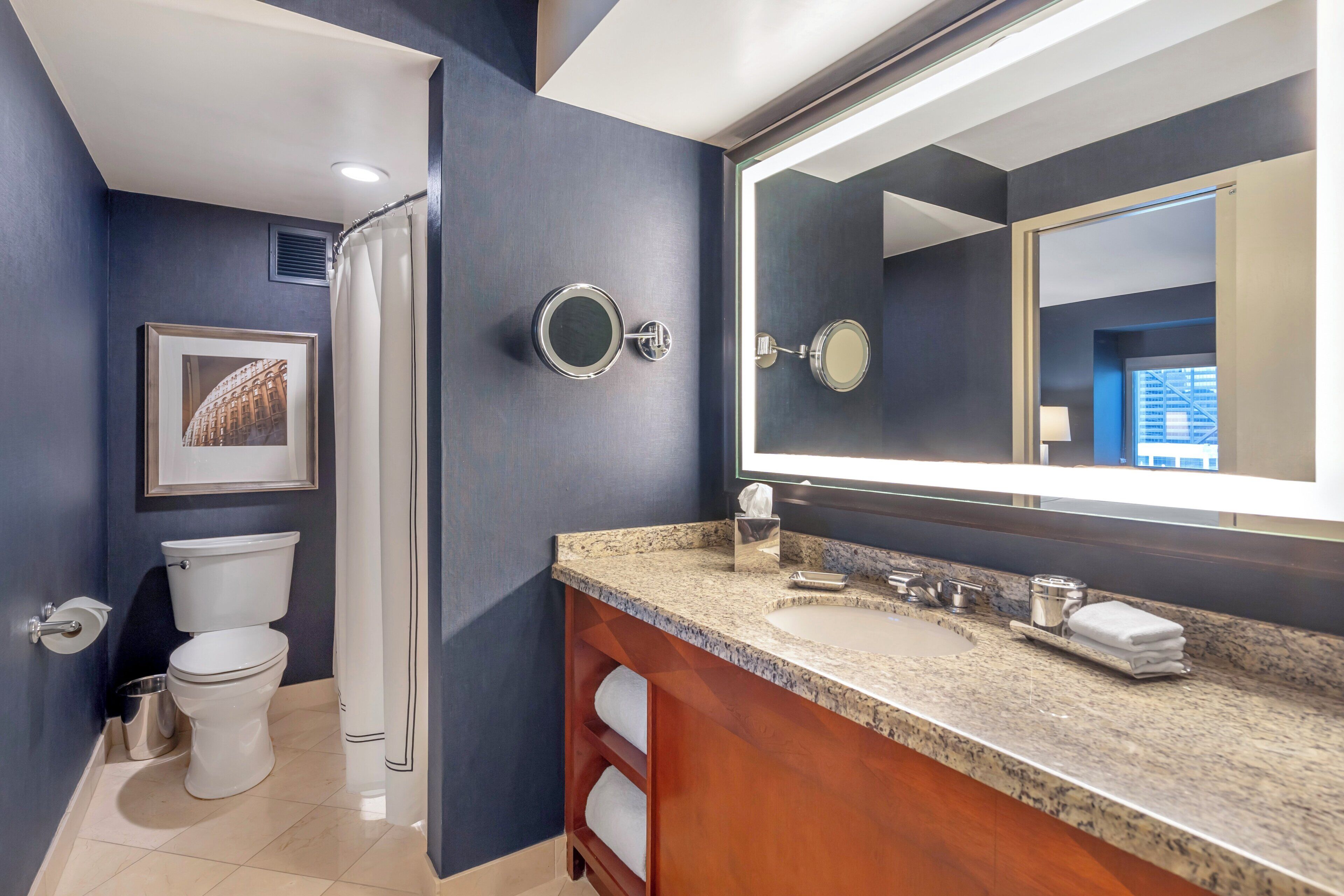 designer toiletries, hair dryer, bathrobes, slippers