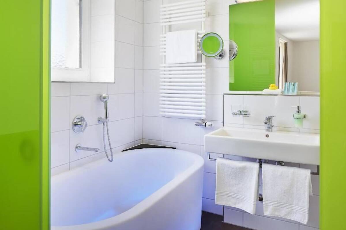 Bathroom | Designer toiletries, hair dryer, towels, soap