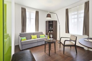 Superior Double Room | Living area | Flat-screen TV