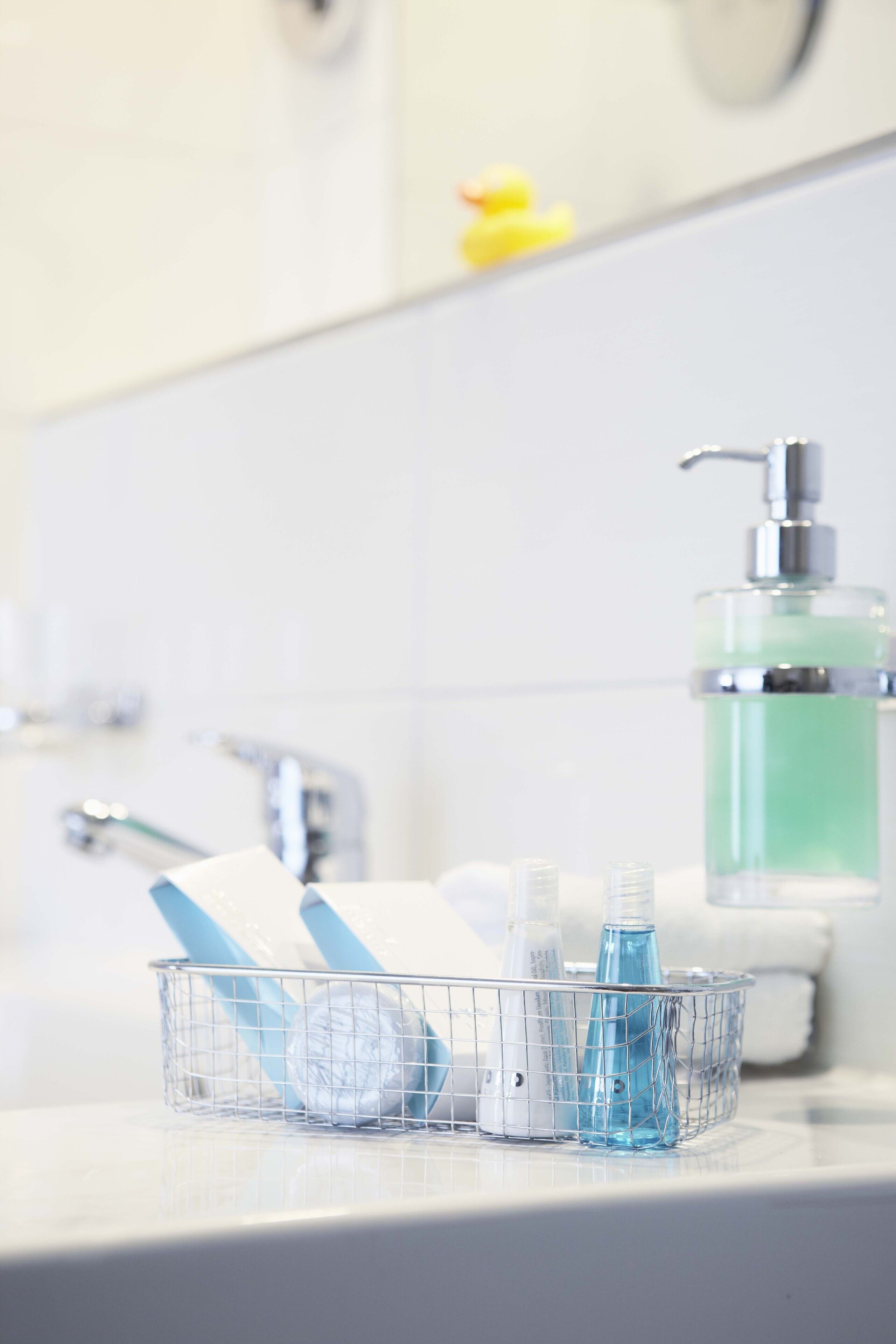 designer toiletries, hair dryer, towels, soap