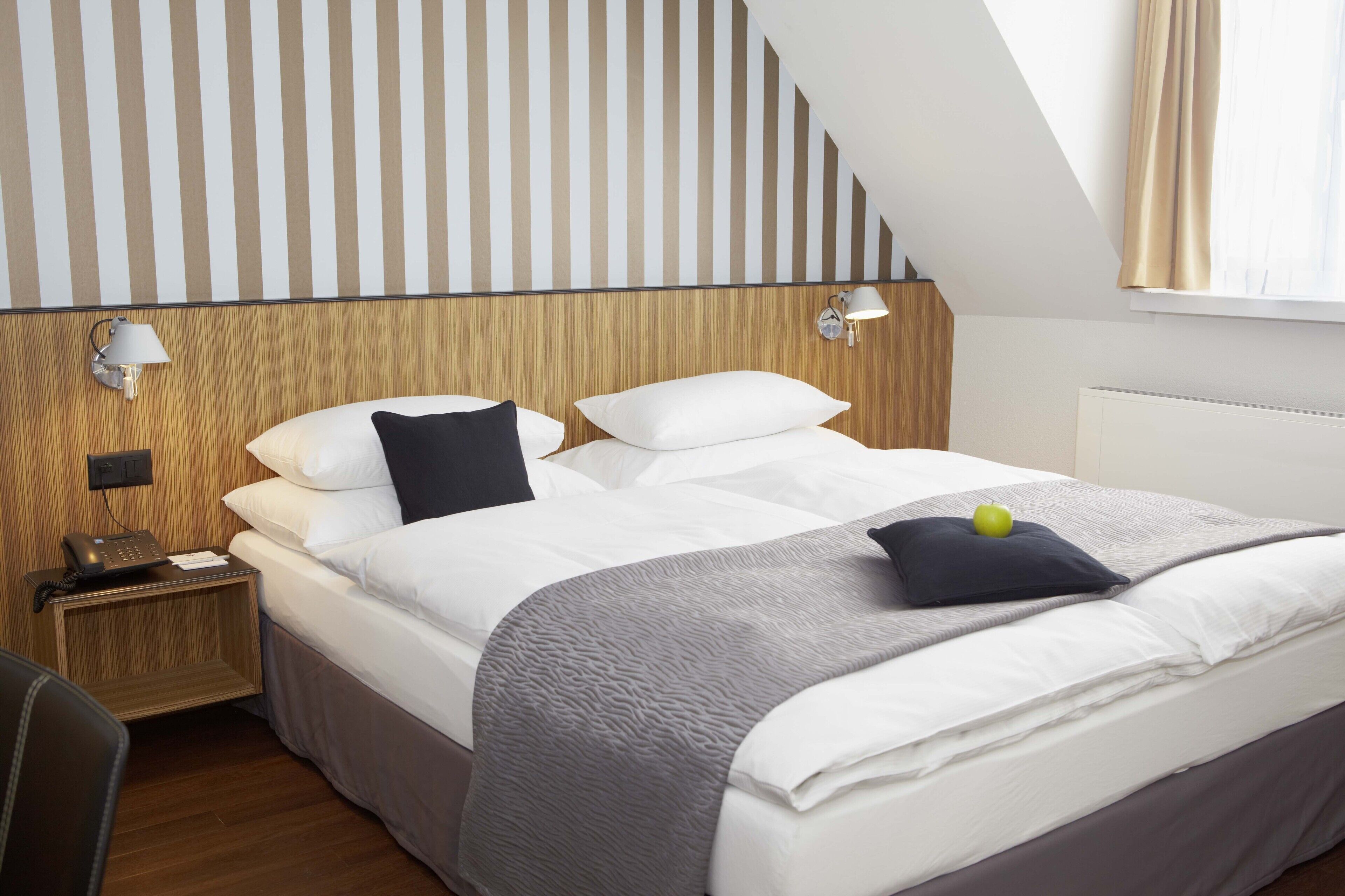 hypo-allergenic bedding, down duvets, minibar, in-room safe