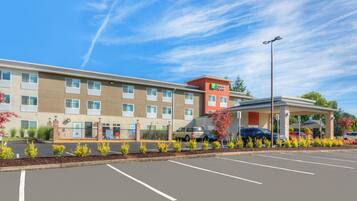 A Holiday Inn Express hotel with a parking lot and a covered entrance.