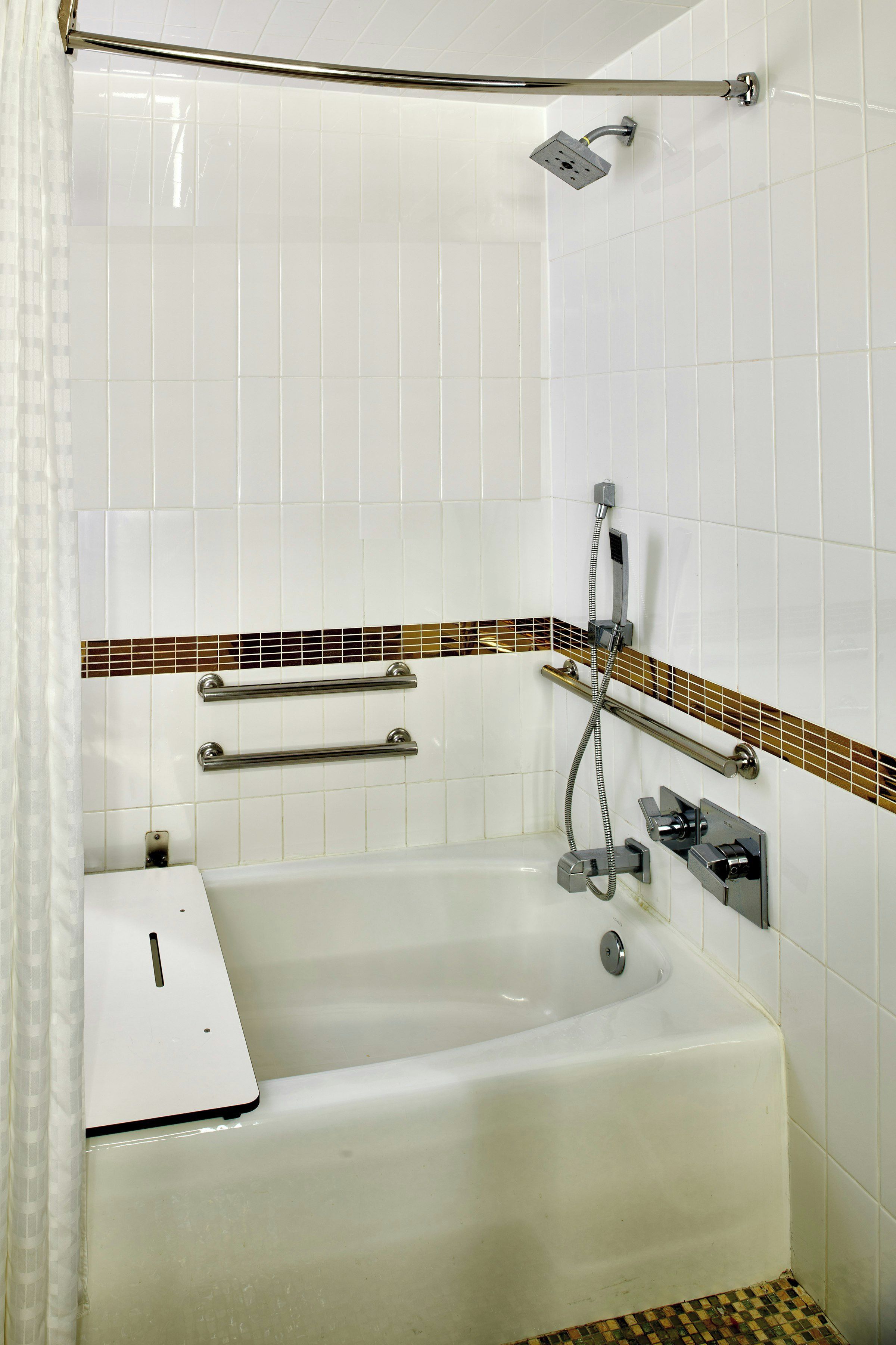 A bathroom with a bathtub, a shower, and a toilet.