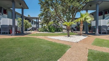 Outdoor pool, open 9:00 AM to 11:00 PM, pool loungers