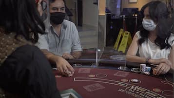 Experience the excitement of blackjack at our casino, where players can place their bets and play for fun.