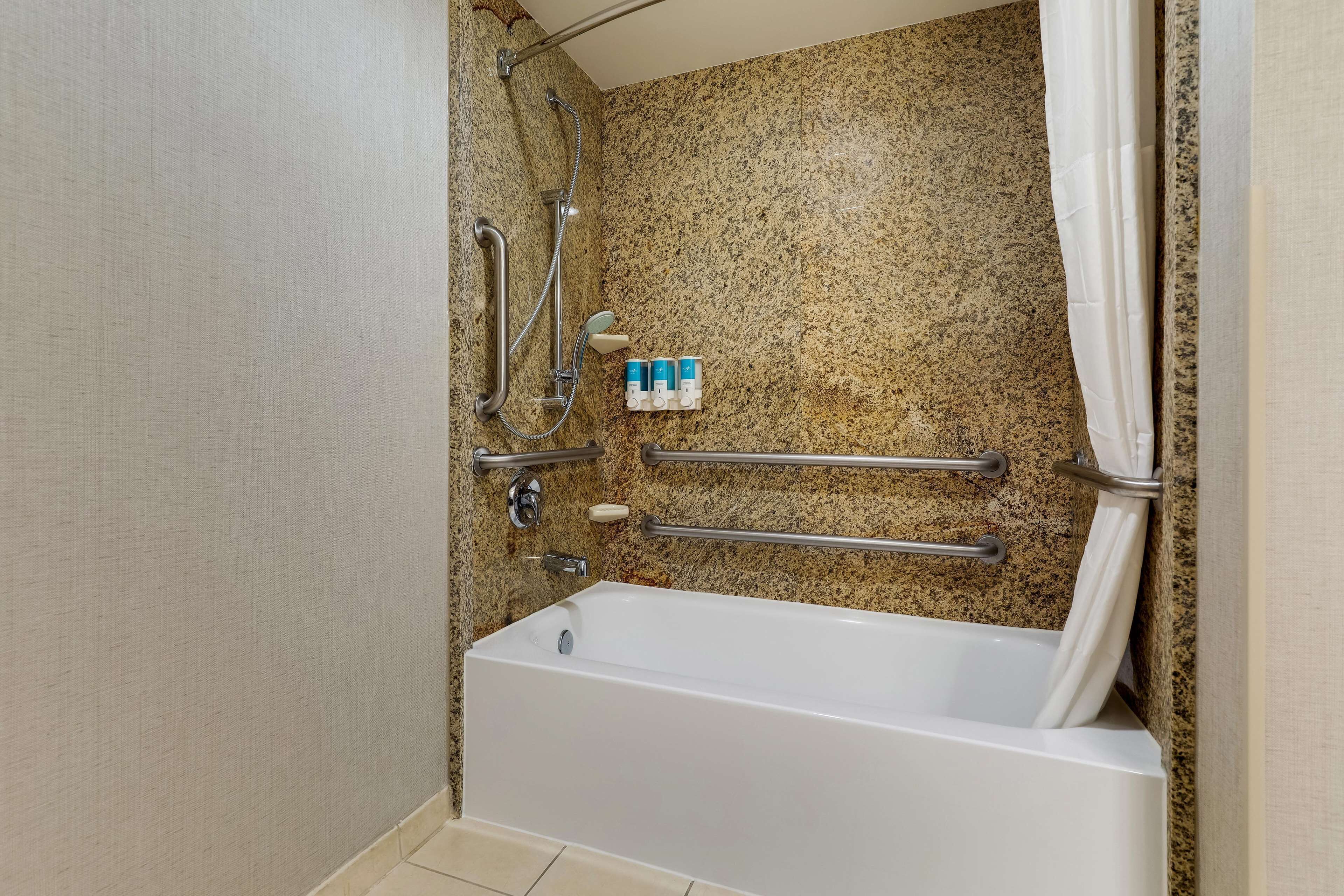 combined shower/bathtub, eco-friendly toiletries, hair dryer, towels