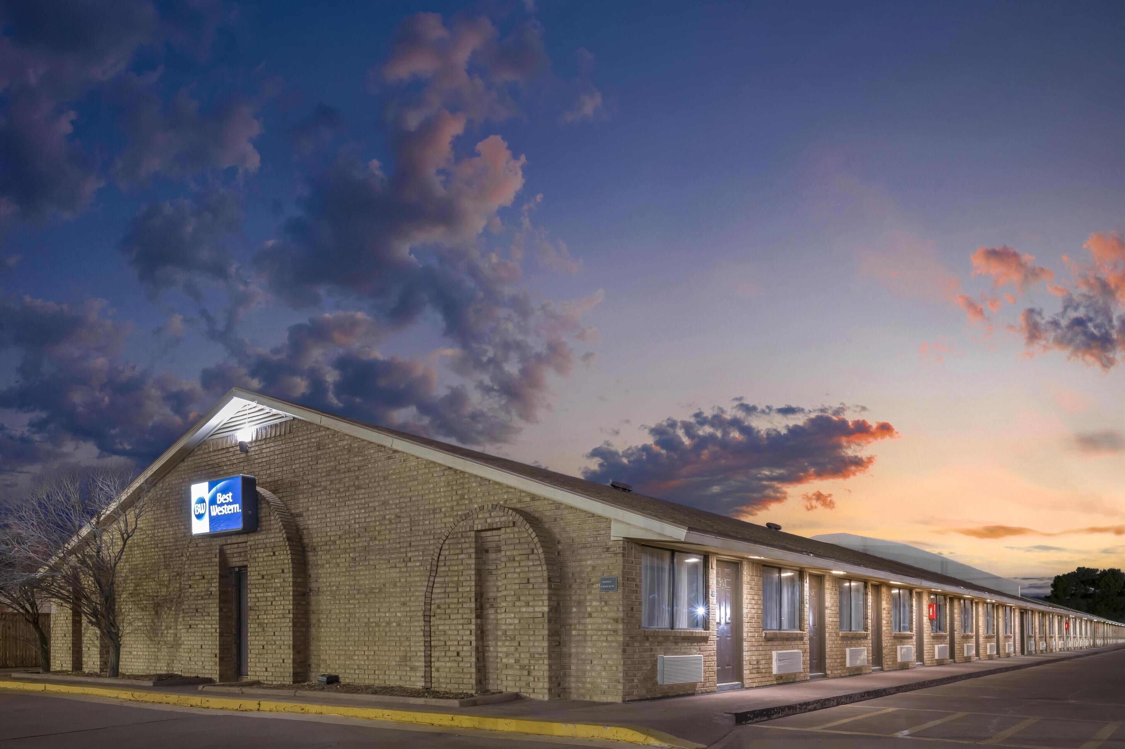 A Best Western hotel with a brick facade, large windows, and a signboard.