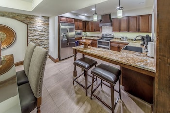 Full-size fridge, microwave, oven, stovetop at Holiday Inn Club Vacations Scottsdale Resort, an IHG Hotel