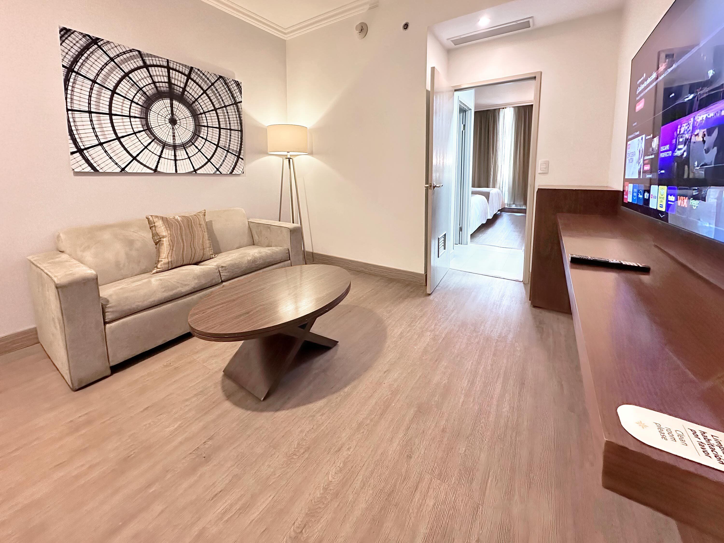 Superior Suite | Living area | 80-inch Smart TV with cable channels