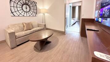 Superior Suite | Living area | 80-inch Smart TV with cable channels