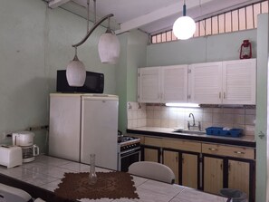 Apartment, 1 Bedroom | Private kitchen | Full-size fridge, oven, stovetop, rice cooker