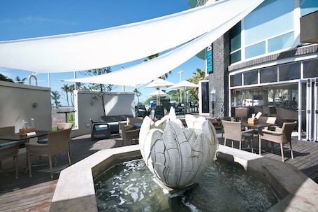 Cocktail bar, beach views. The Blue Waters Hotel