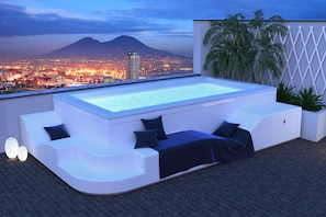 Seasonal outdoor pool, open 10:30 AM to 7:30 PM, pool loungers