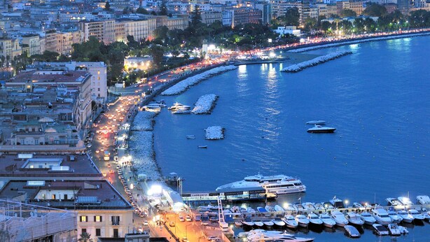 A marina with boats docked, a waterfront promenade, and buildings along the coast. - Hotel Paradiso, BW Signature Collection (Naples)