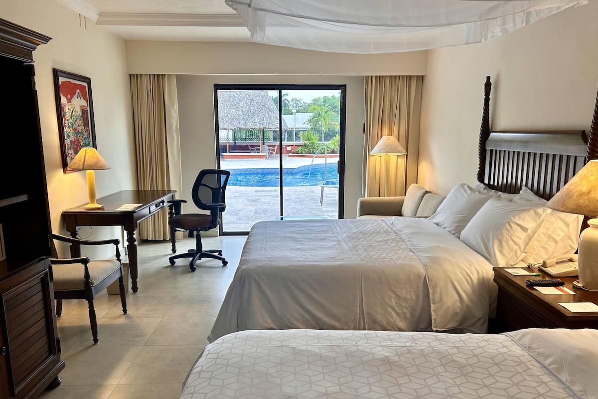 Premium Room, 2 Double Beds | Down comforters, in-room safe, desk, laptop workspace