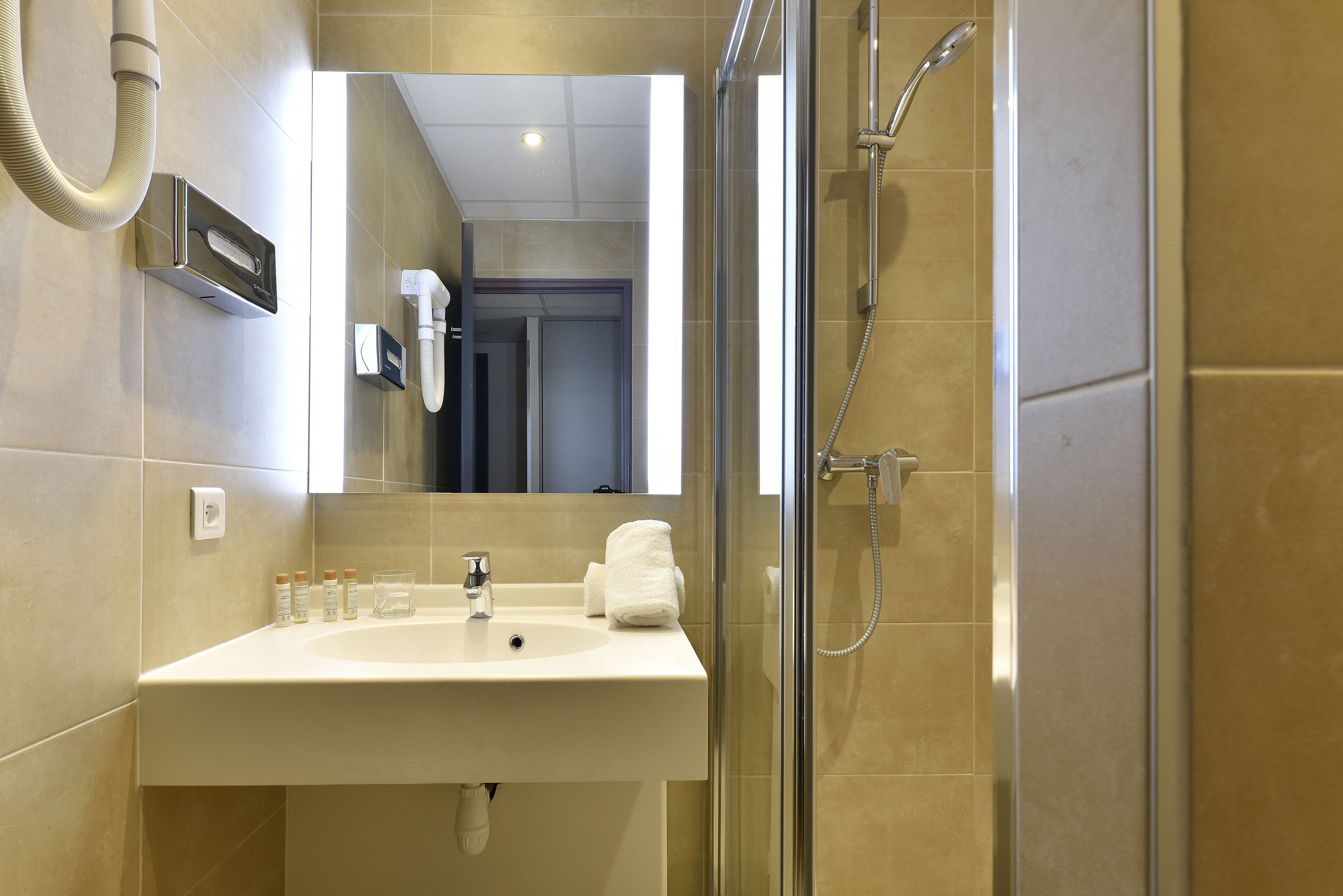 free toiletries, hair dryer, slippers, towels