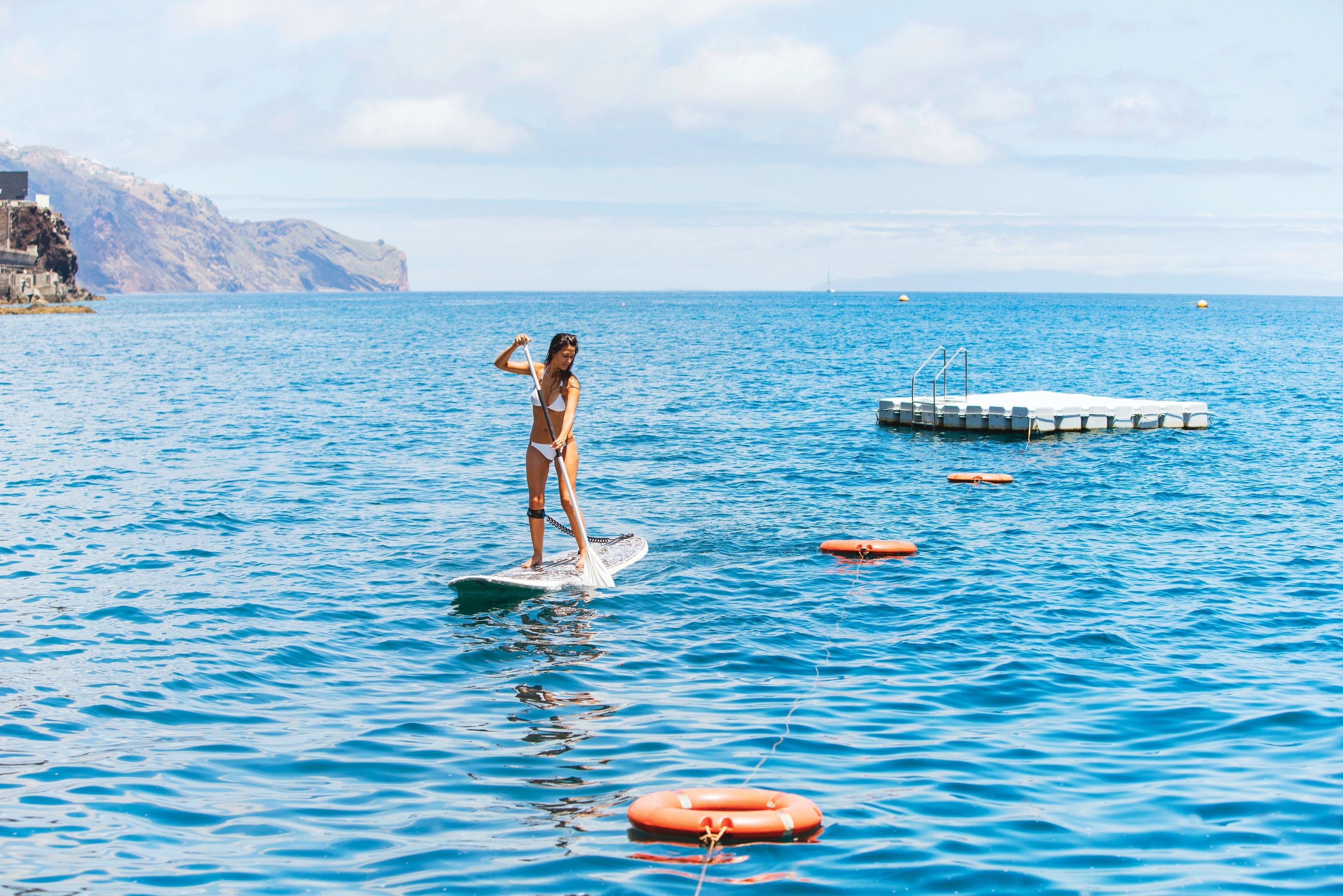 on the beach, black sand, motor boating, fishing