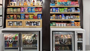 A snack and beverage vending area with various snacks and drinks. - Hampton Inn Bridgeport/Clarksburg (Bridgeport)