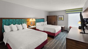 A hotel room with two beds, a desk, a chair, a TV, and a window with a view. - Hampton Inn Bridgeport/Clarksburg (Bridgeport)