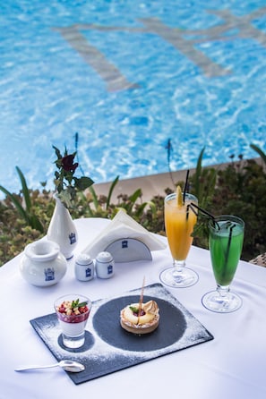 Indoor pool, outdoor pool, open 10:00 AM to 6:00 PM, pool umbrellas