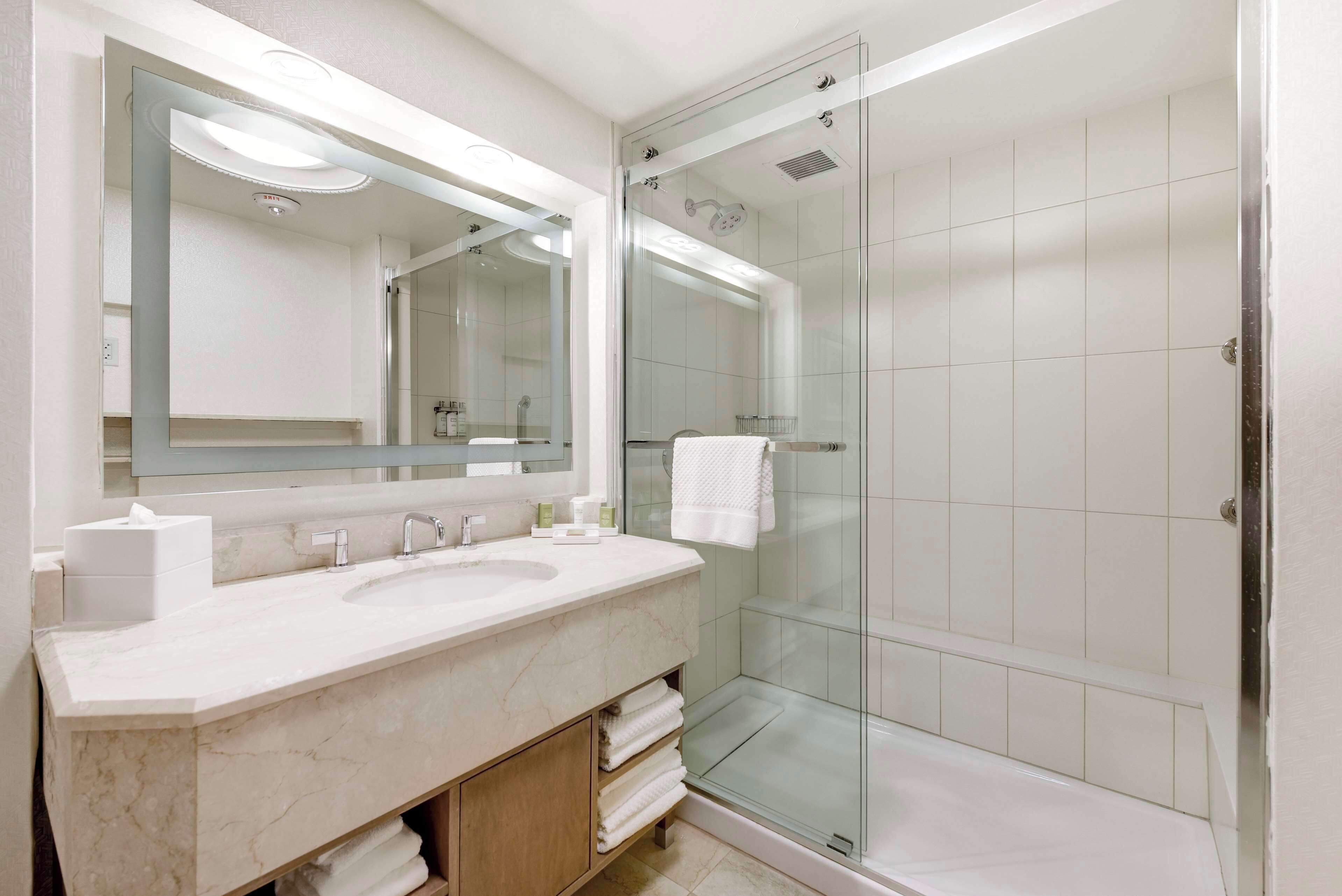 designer toiletries, hair dryer, towels