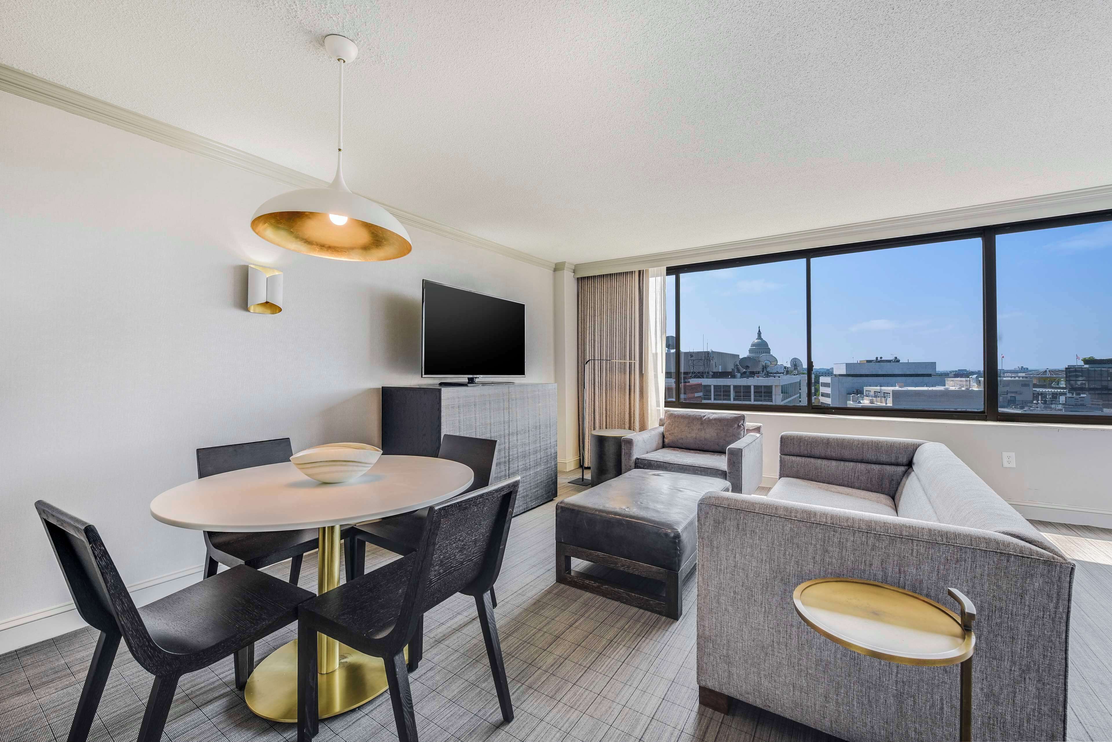 deluxe room, 1 king bed (capitol view) | living area | 55-inch tv with cable channels