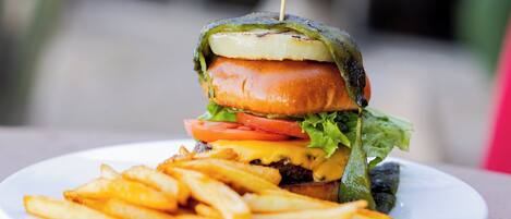 A plate with a sandwich and fries.