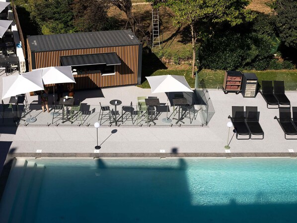Seasonal outdoor pool, open 9:00 AM to 8:00 PM, pool umbrellas