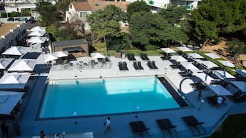 Seasonal outdoor pool, open 9:00 AM to 8:00 PM, pool umbrellas