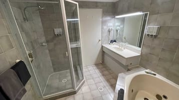 Separate bathtub and shower, jetted bath, free toiletries, hair dryer