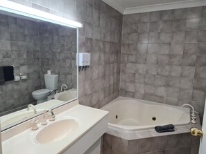 Separate tub and shower, jetted tub, free toiletries, hair dryer