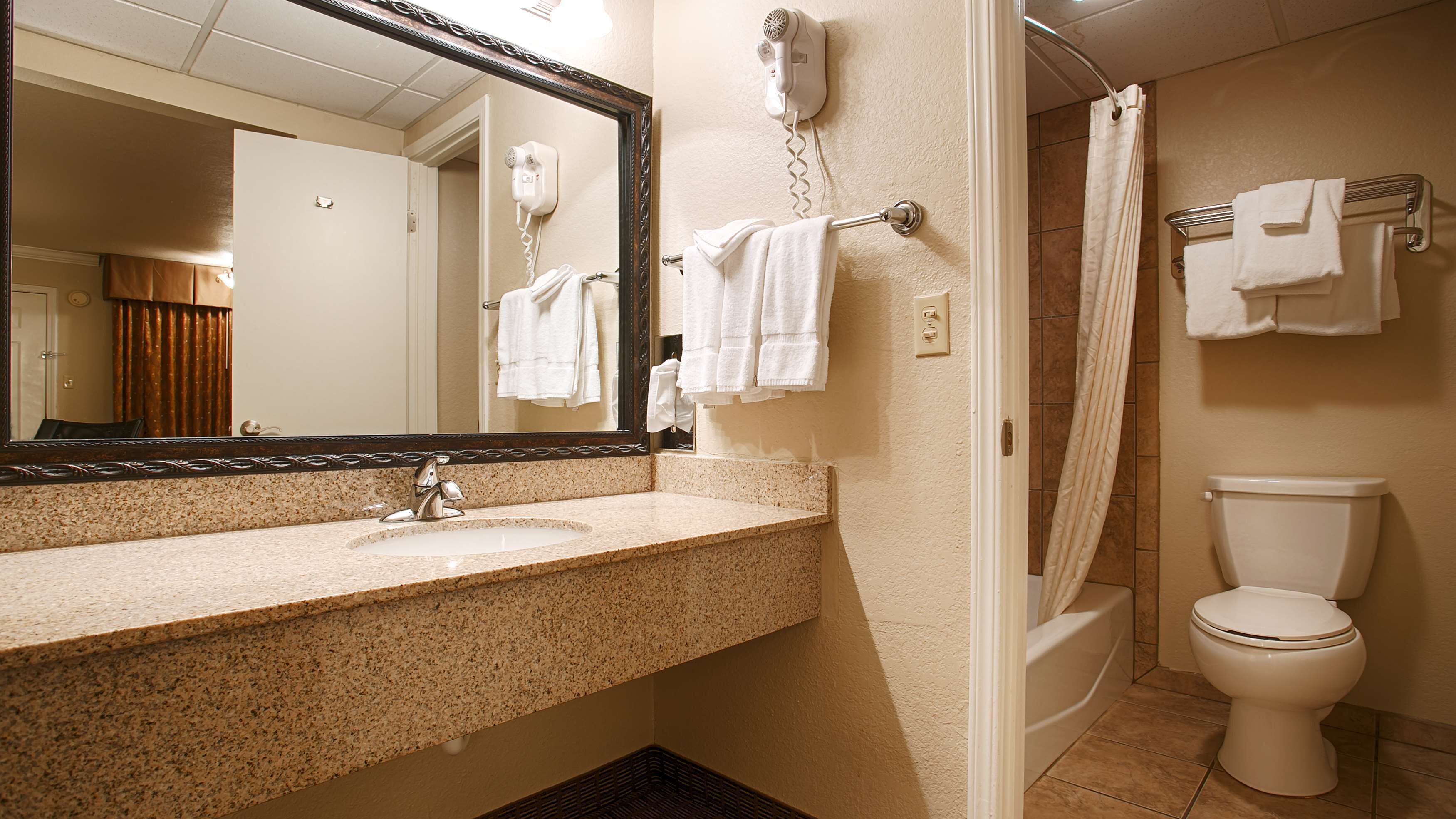 bathtub, free toiletries, hair dryer, towels