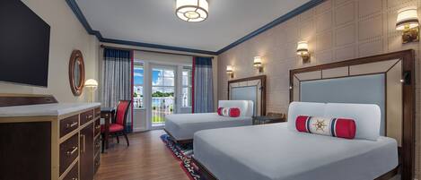A hotel room with two beds, a desk, a chair, and a large window with curtains.