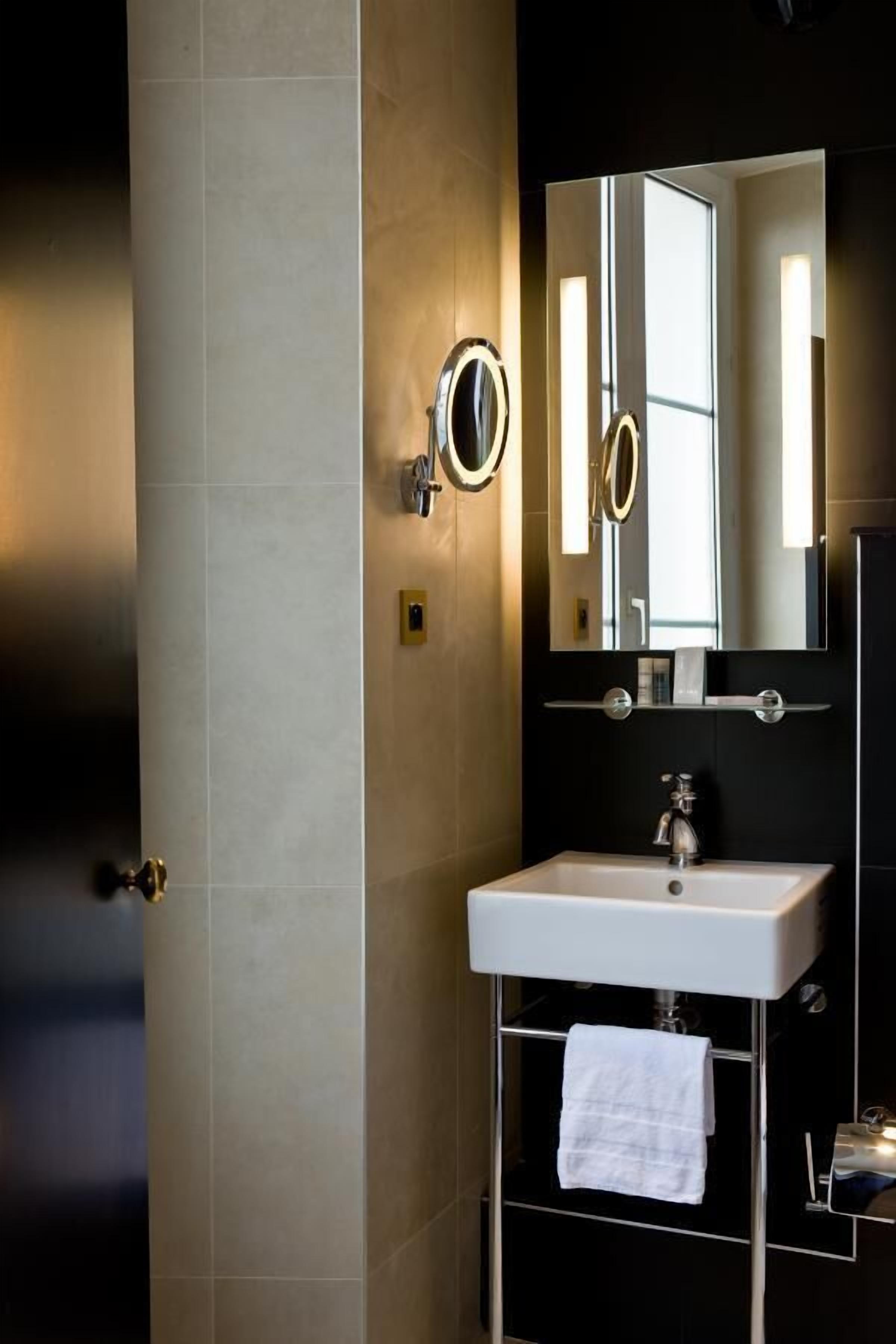 eco-friendly toiletries, hair dryer, slippers, towels